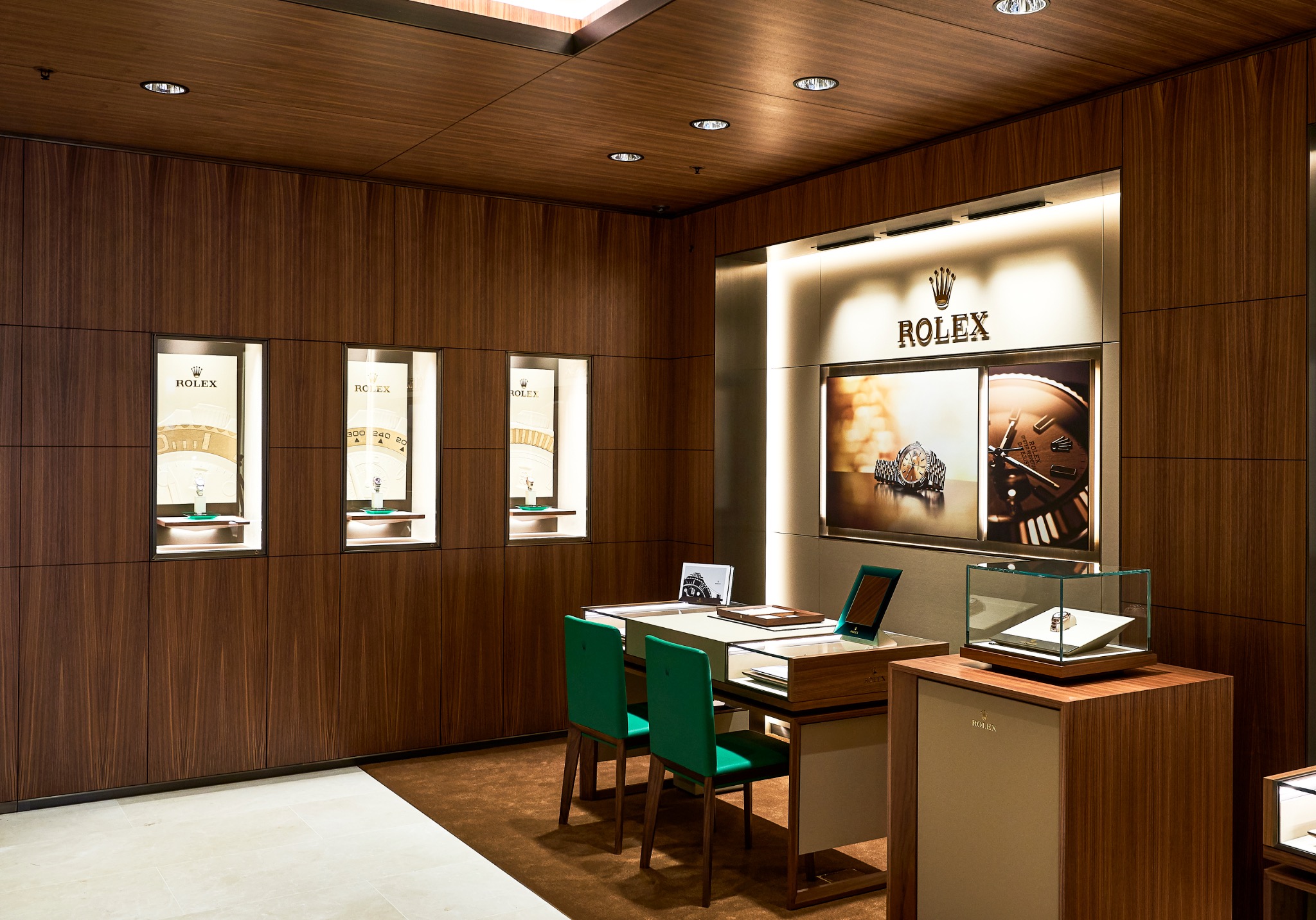 Timber-lined private consultation space with integrated lighting in the Rolex Glasgow showroom
