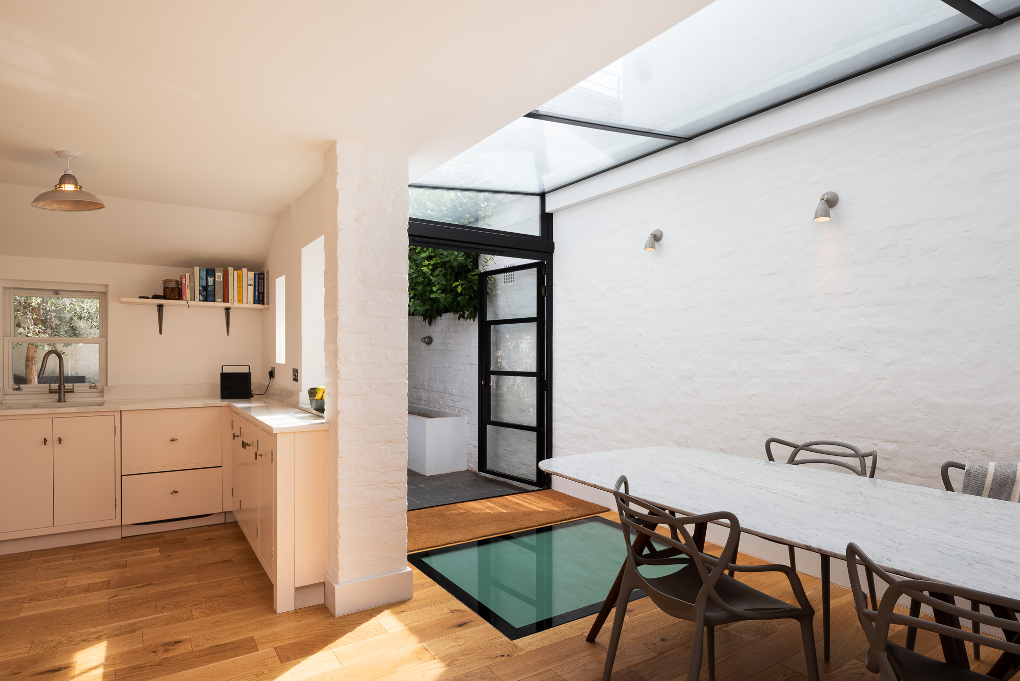 Kitchen and dining area joined by a glazed courtyard opening at Roupell Street, London