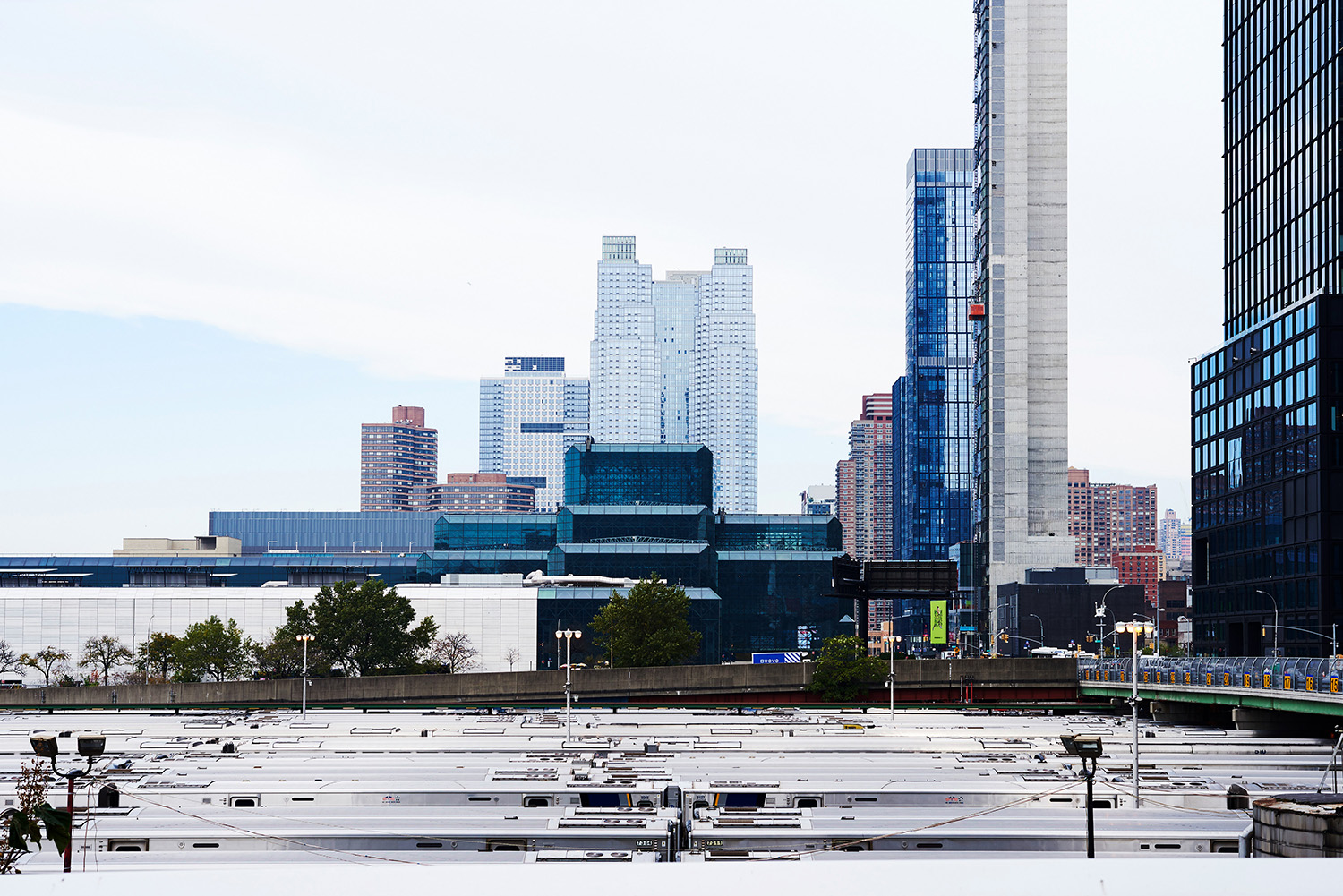 New York railway infrastructure forming a broad foreground beneath the skyline