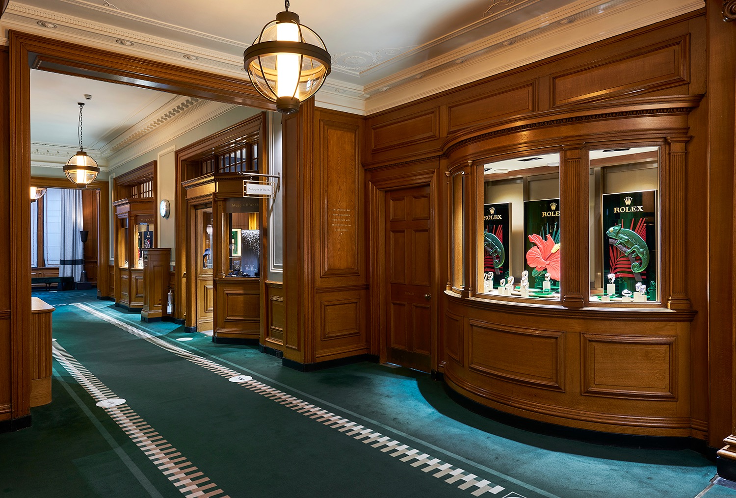 Mappin and Webb displays integrated into a timber-panelled interior at Gleneagles