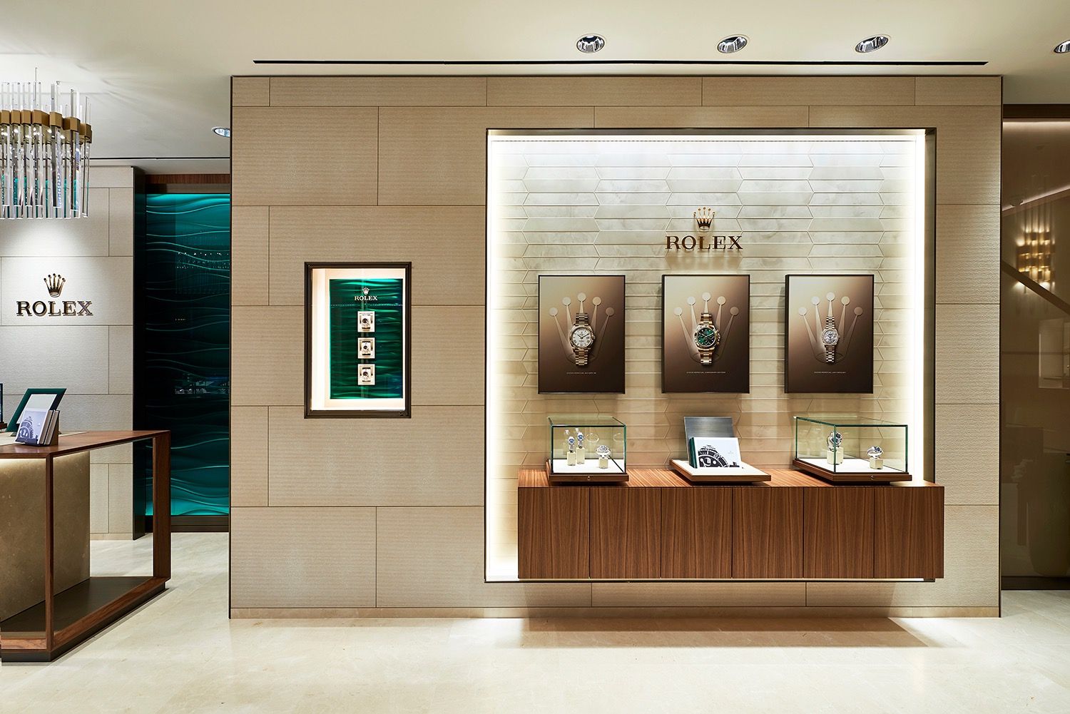 Illuminated Rolex display wall within a pale stone interior