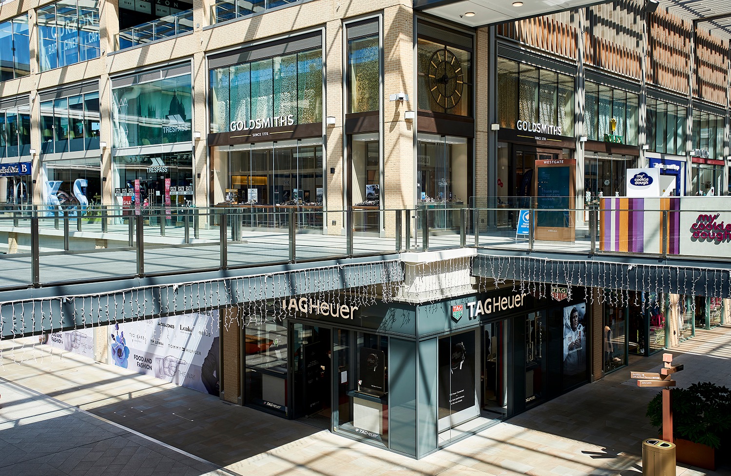 TAG Heuer frontage extending across levels within a glazed urban shopping centre