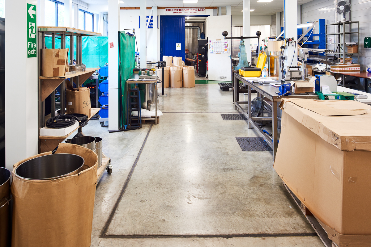 Working manufacturing floor with machinery, materials and circulation space